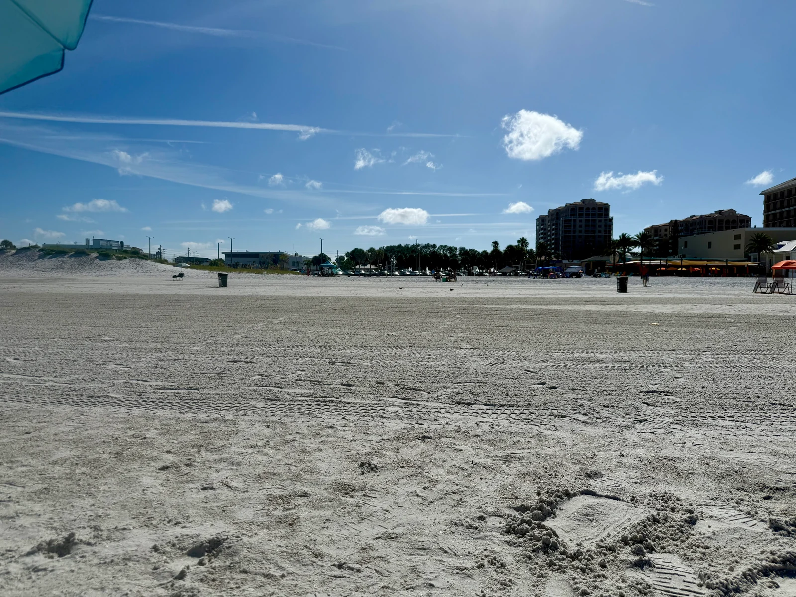Wide sandy Clearwater Beach looking inland toward beachfront restaurants and hotels