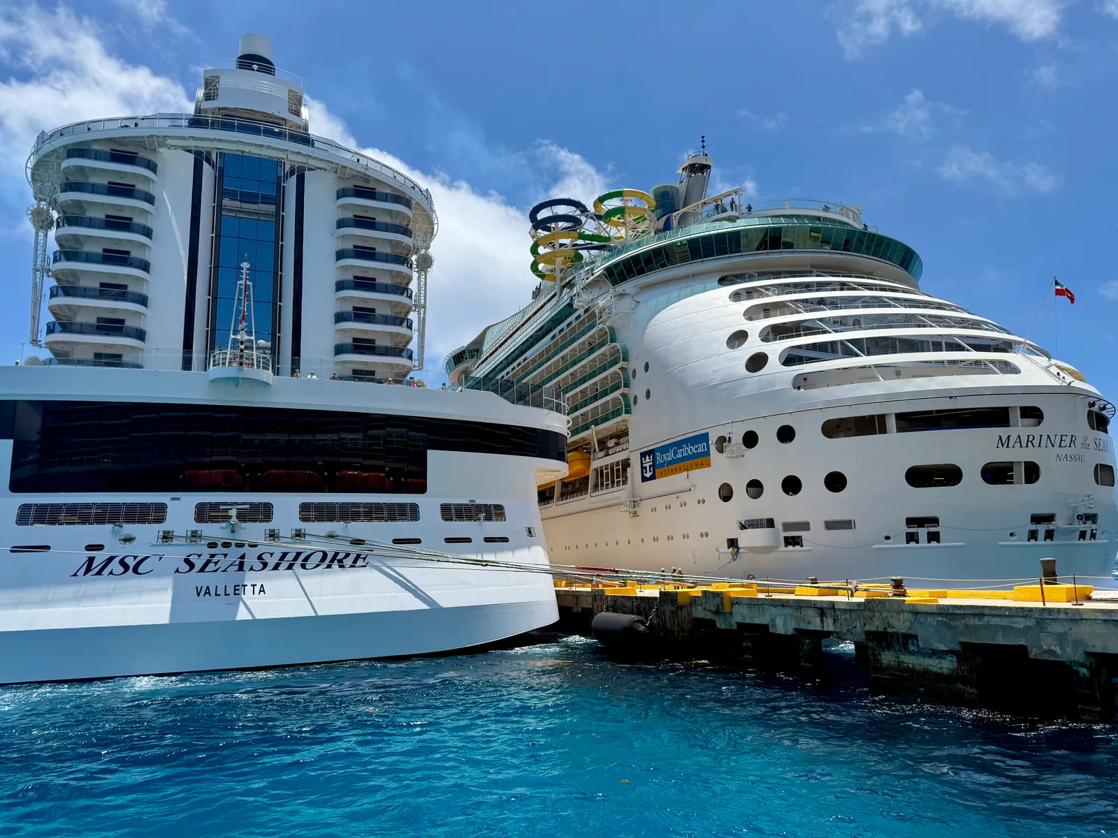 Cruise ships docked beside the Costa Maya pier above turquoise water