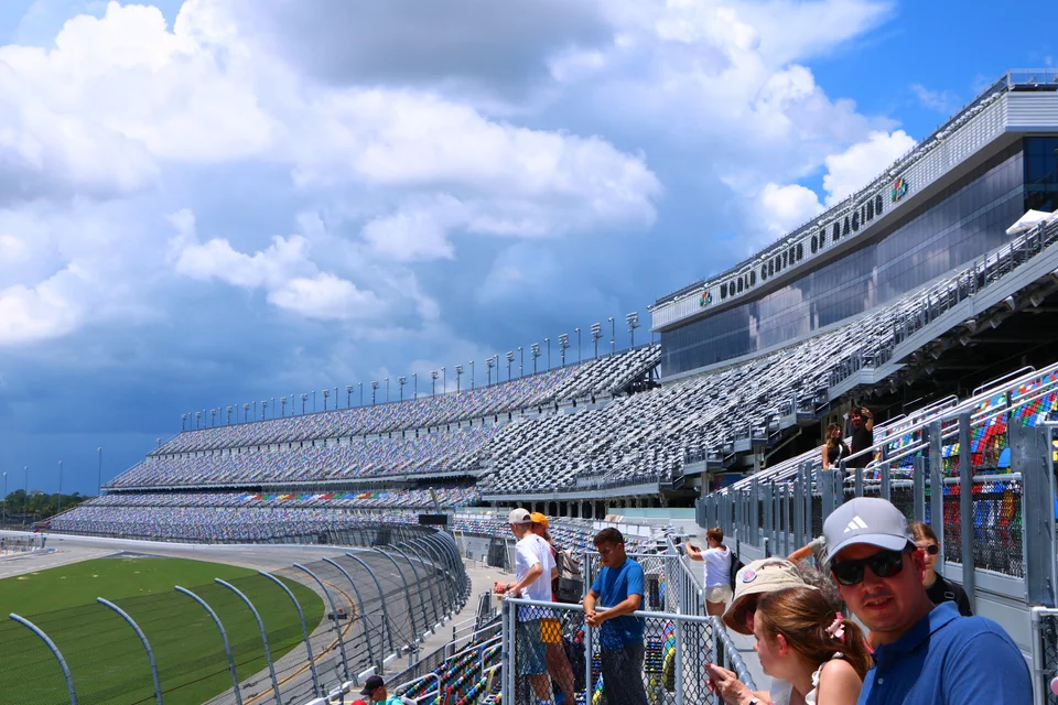Banked track, grandstands and race control building at Daytona International Speedway