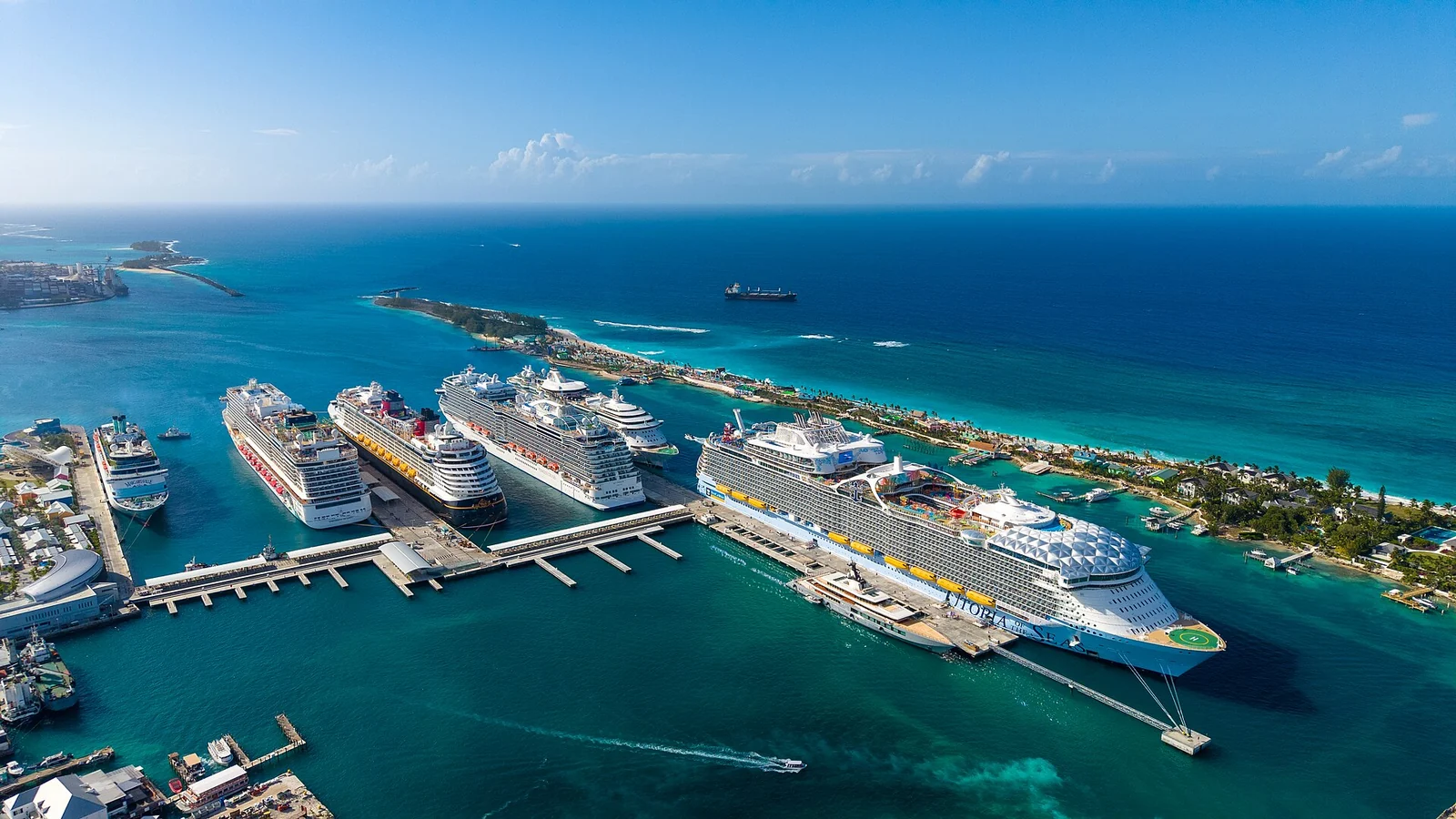Cruise ships docked in turquoise Nassau Harbour with the city and Paradise Island beyond