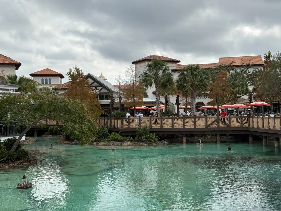 Turquoise water and waterfront buildings at Disney Springs