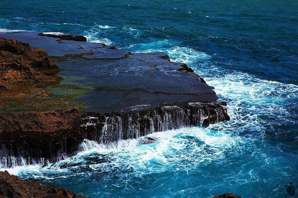 Isabela coastal rocks — Rocks in the water just a few seconds before a large wave came and crashed against it. It is an incredible view, located on the northern coast of Puerto Rico.