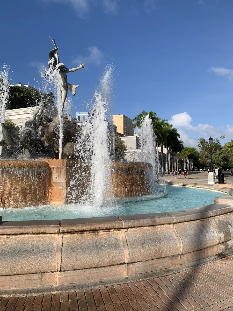 Raíces fountain at Paseo de la Princesa beneath a blue sky