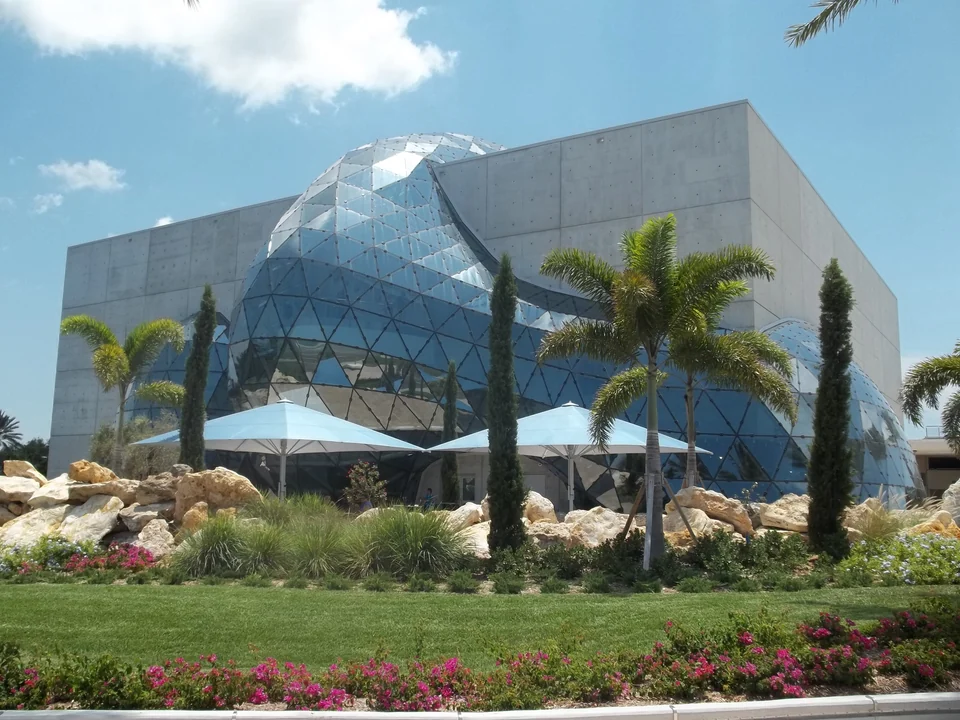 Glass geodesic structure and palm trees outside The Dalí Museum in St. Petersburg