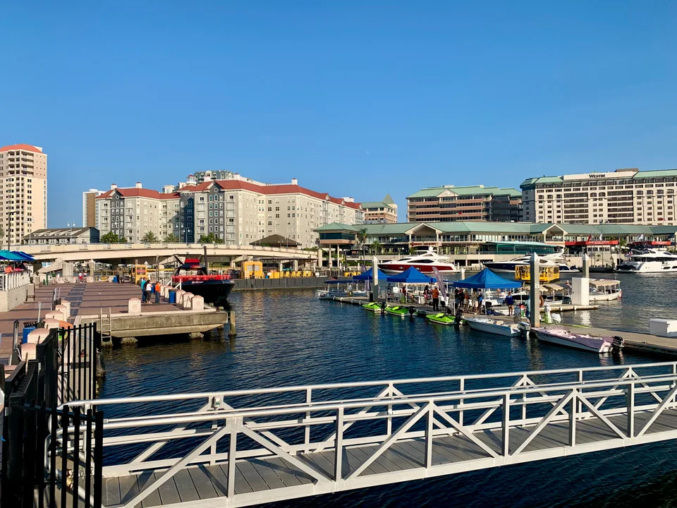 Downtown Tampa channel with docked boats and waterfront buildings